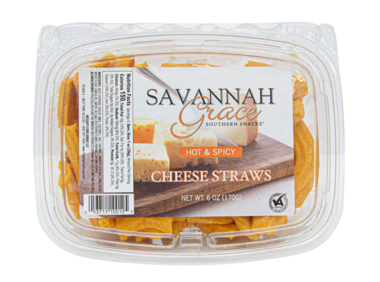 A clear plastic tub containing cheese straws with a 'Savannah Grace' brand label indicating 'Hot & Spicy' and net weight.