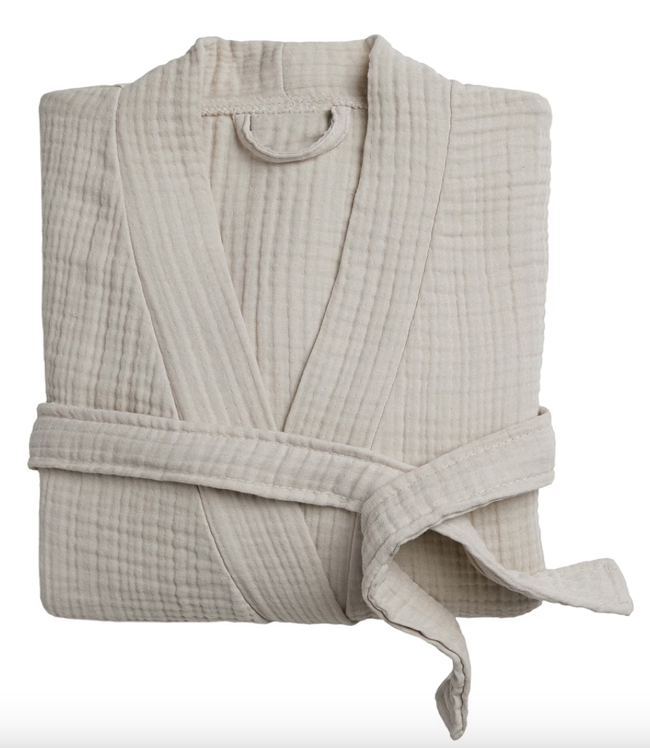 A beige muslin robe with a hood, laid flat on a white background.