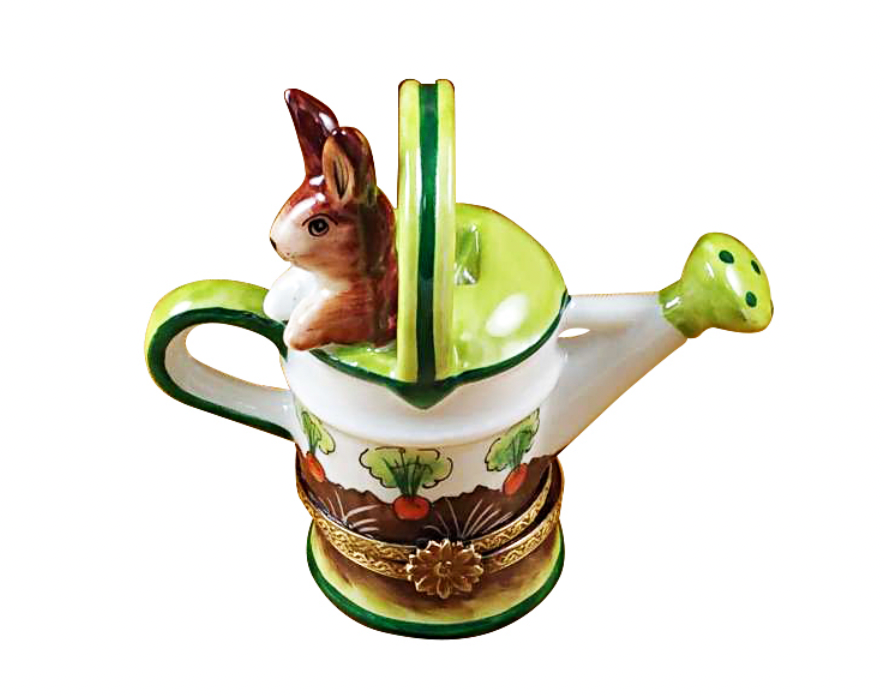 Decorative teapot with a rabbit design on a white background