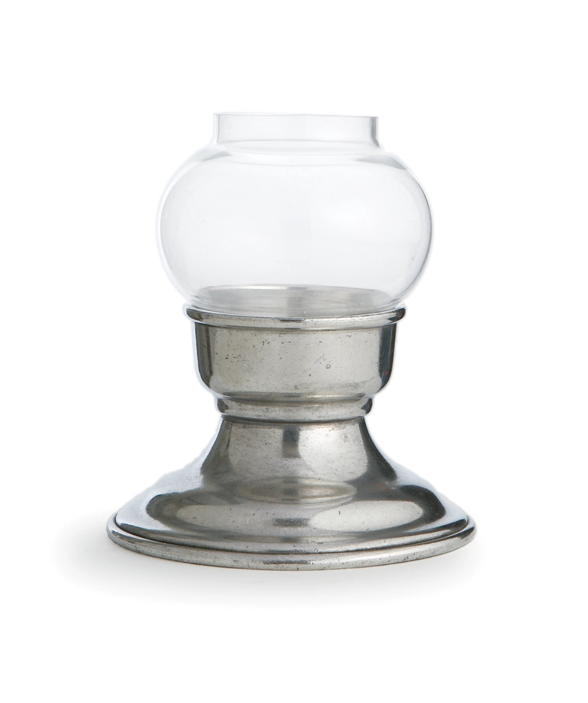 A clear glass tealight votive with a metallic base, isolated on a white background.