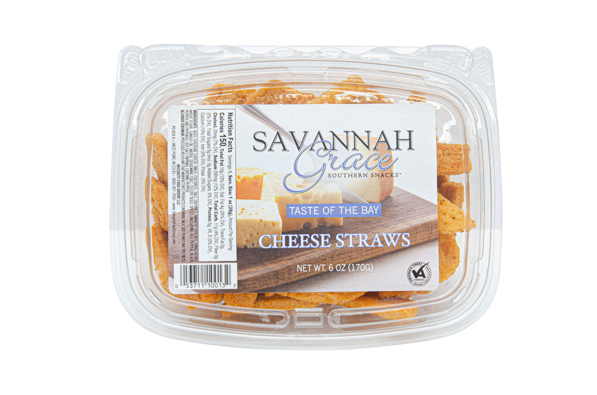 A clear plastic tub containing cheese straws with 'Savannah Grace' and 'Taste of the Bay' labeled on it.