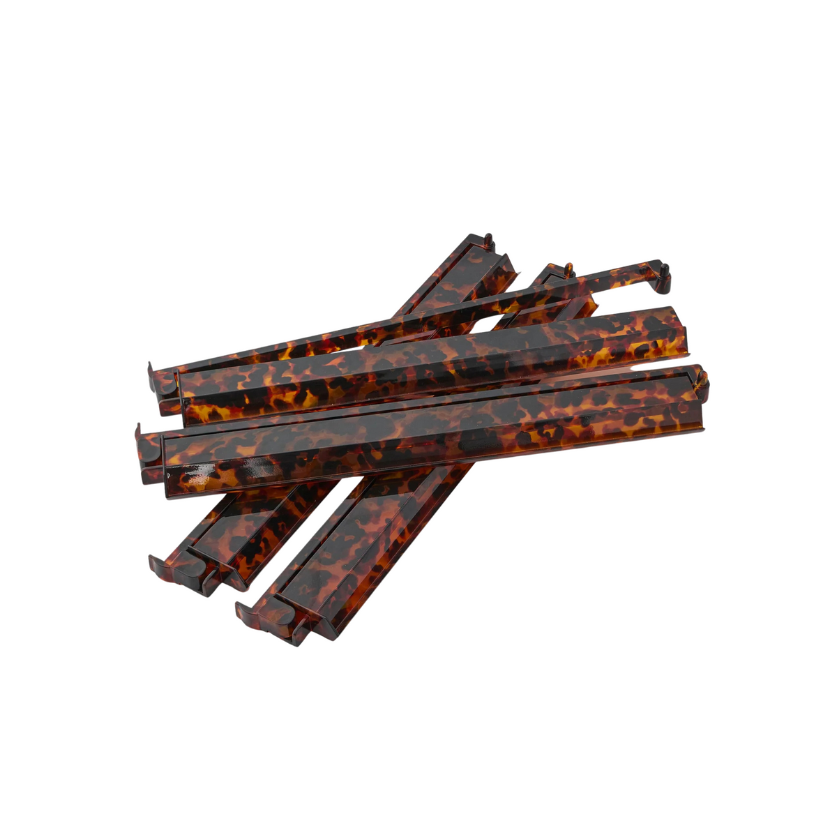 Set of tortoiseshell mahjong racks on a white background