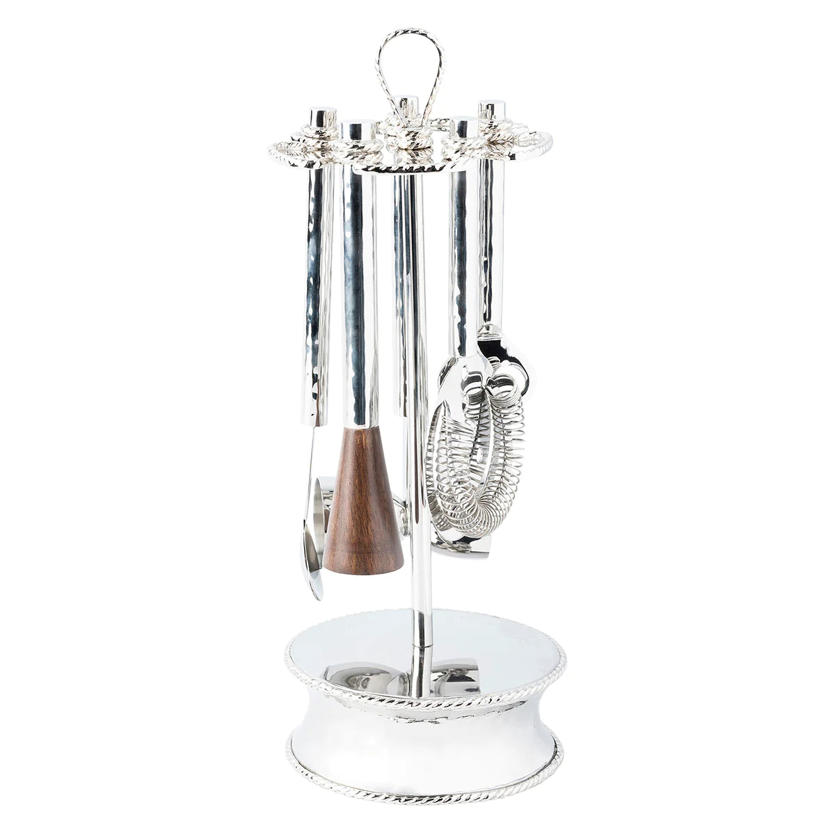 A set of stainless steel bar tools mounted on a white stand, including a double-sided jigger, cocktail strainer, bar spoon, bottle opener, and muddler.